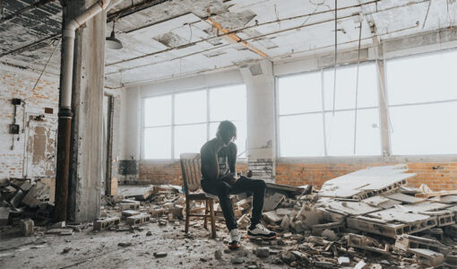 man-sitting-in-abandoned-place